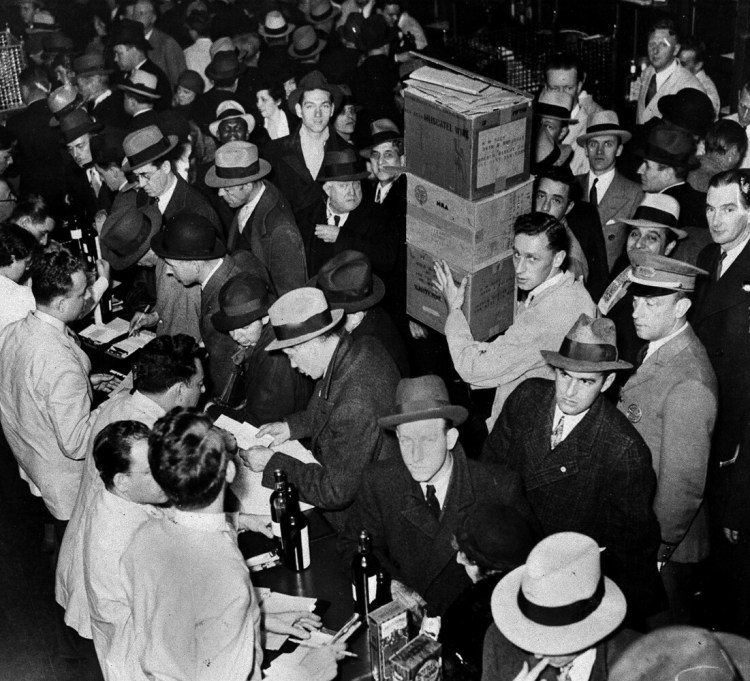 As soon as the prohibition repeal was ratified, wholesale houses got busy delivering the goods to anxious customers, as seen in New York, Dec. 5, 1933. 