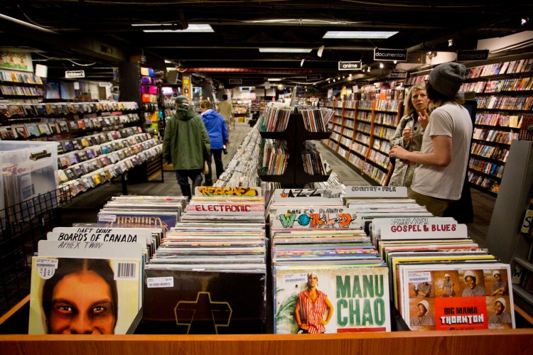 PORTLAND, ME - JUNE 13: Patrons make their way through Bull Moose Music on Middle Street in Portland  Friday, June 13, 2014. (Photo by Gabe Souza/Staff Photographer)
