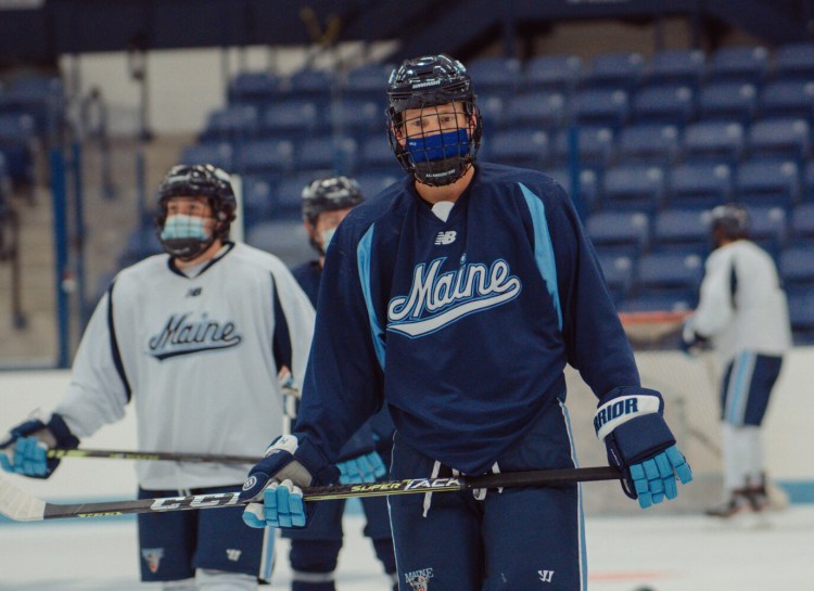 The University of Maine men's hockey team skates during a recent practice. The Black Bears have struggled defensively during their first four games, committing 29 penalties and allowing 21 goals.