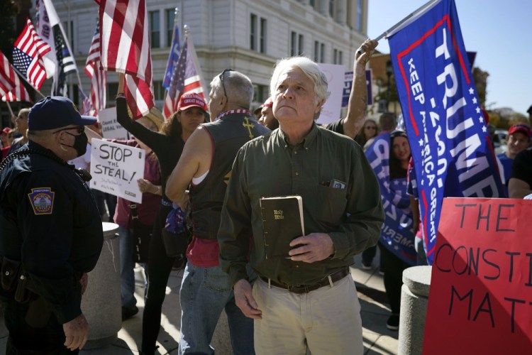Supporters of President Trump demonstrate outside the Pennsylvania State Capitol, Saturday in Harrisburg, Pa., after Democrat Joe Biden defeated President Donald Trump to become 46th president of the United States.