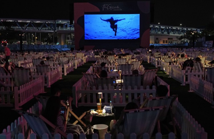 People watch "Jaws" in Hong Kong's first socially-distanced outdoor entertainment park on Tuesday. 