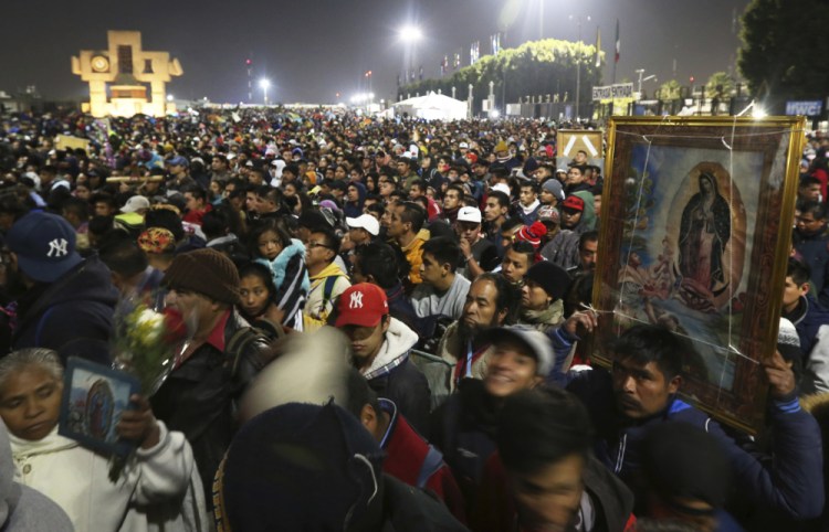 Pilgrims arrive at the plaza outside the Basilica of Our Lady of Guadalupe in Mexico City on Dec. 12, 2019. The annual gathering is the largest Catholic pilgrimage worldwide. 

