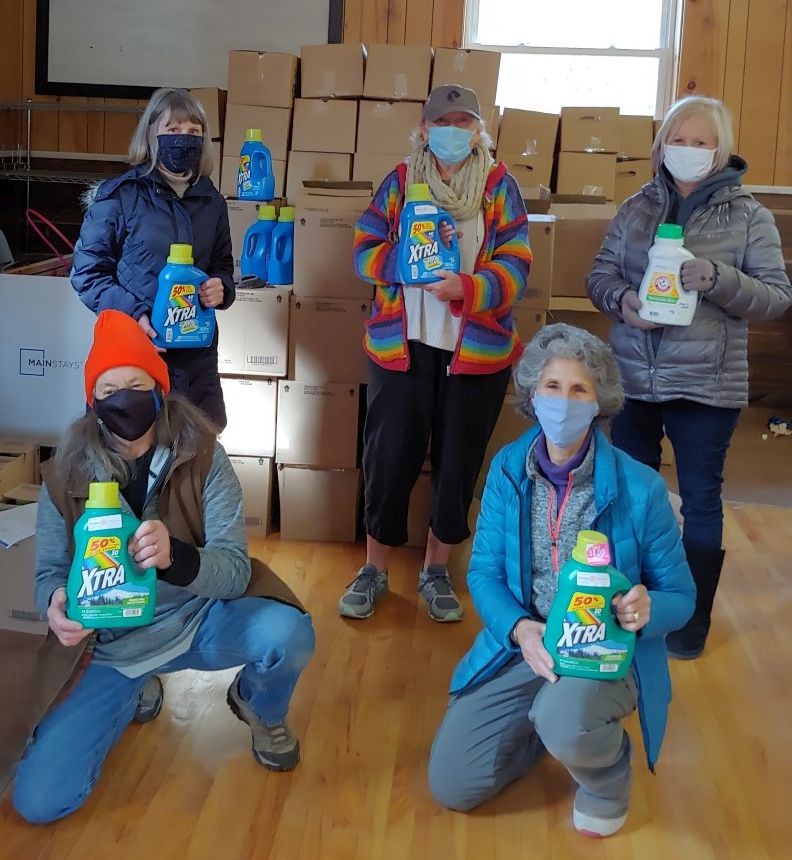 Rotarians donate laundry detergent to Harrison Food Bank