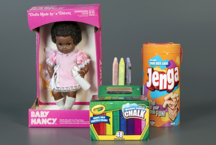 Baby Nancy, by Shindana Toys; Sidewalk Chalk, by Crayola; and Jenga, by Parker Brothers, left to right, were inducted into the National Toy Hall of Fame on Thursday. The honorees were chosen by a panel of experts from among 12 finalists and will be on permanent display inside The Strong National Museum of Play, in Rochester, New York.