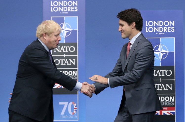 British Prime Minister Boris Johnson, left, welcomes Canadian Prime Minister Justin Trudeau Dec. 4 for a NATO leaders meeting in Watford, Hertfordshire, England. 

