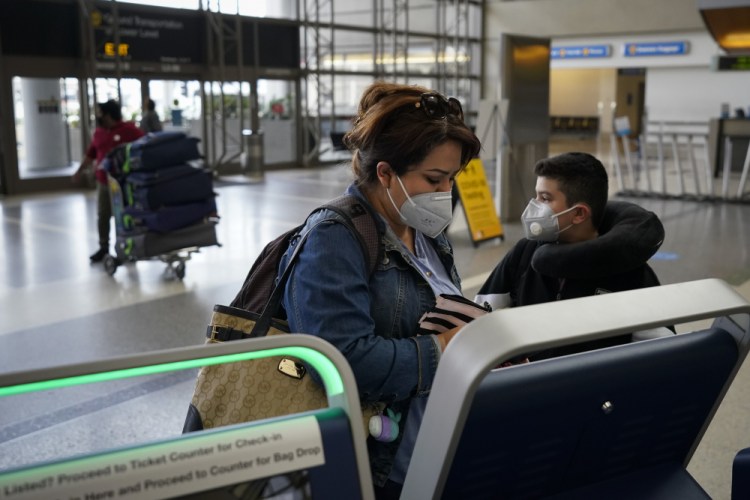 Esmeralda Elizalde checks in for her flight to Mexico at the Los Angeles International Airport on Monday.
