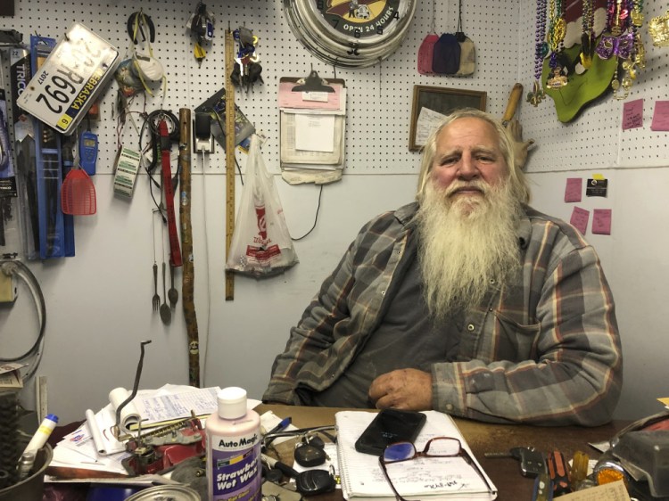 Danny Rice, 67, discusses the coronavirus in his auto repair shop in downtown Elmwood, Neb., on Monday. Rice has continued his life as normal during the pandemic, even though he recognizes that the virus is potentially dangerous for high-risk people, including him. 
