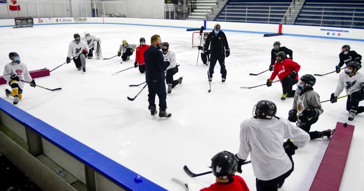 HALLOWELL, ME - DECEMBER 8: Hawks head coach Richard Forting talks to players during practice Tuesday December 8, 2020 at the Ice Vault in Hallowell. (Staff photo by Joe Phelan/Staff Photographer)