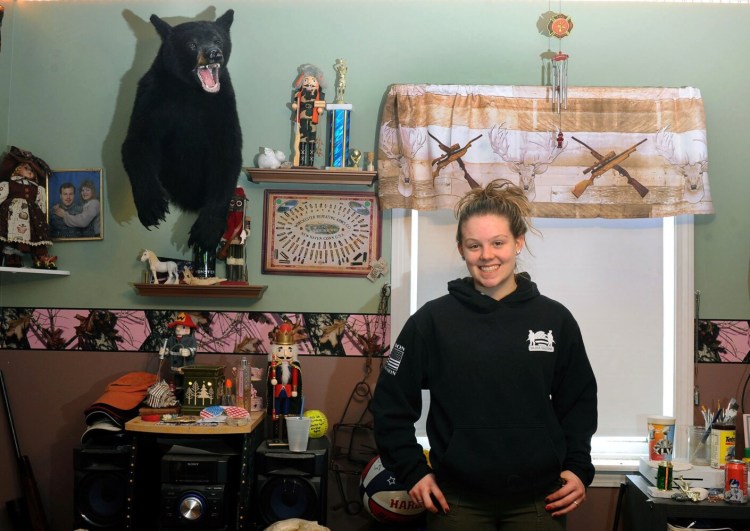 Cassidy Rood, 16, at her Benton home Sunday. She is already an accomplished hunter who recently completed the "grand slam" of big game hunting by bagging a turkey, bear, deer and moose in one year.
