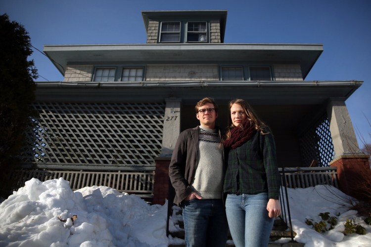SOUTH PORTLAND, ME - DECEMBER 22: Andrew McDonnell and Devon Van Demark outside their rental home in South Portland. The couple is hoping to buy a house by the time they get married in September. They've been searching since August and are getting a bit frustrated, having made eight above-asking-price offers without success. (Staff photo by Ben McCanna/Staff Photographer)