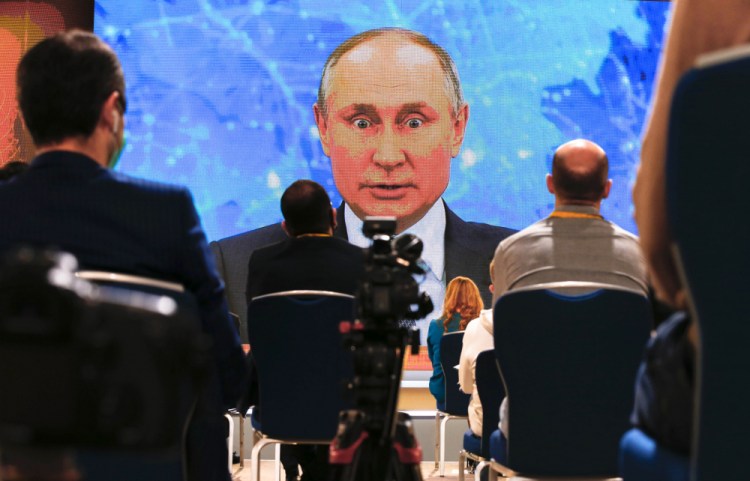 Russian President Vladimir Putin speaks via video call during a news conference in Moscow, Russia, Thursday, Dec. 17. 