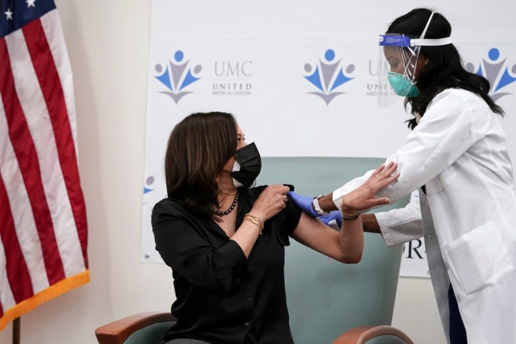 Vice President-elect Kamala Harris thanks nurse Patricia Cummings after she received the Moderna COVID-19 vaccine from Cummings, Tuesday Dec. 29, at United Medical Center in southeast Washington. 