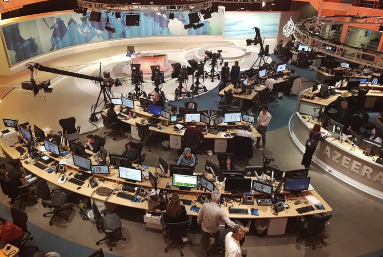 Al-Jazeera staff work at their TV station in Doha, Qatar, in 2017. Citizen Lab at the University of Toronto tied the attacks “with medium confidence” to Emirati and Saudi governments. 