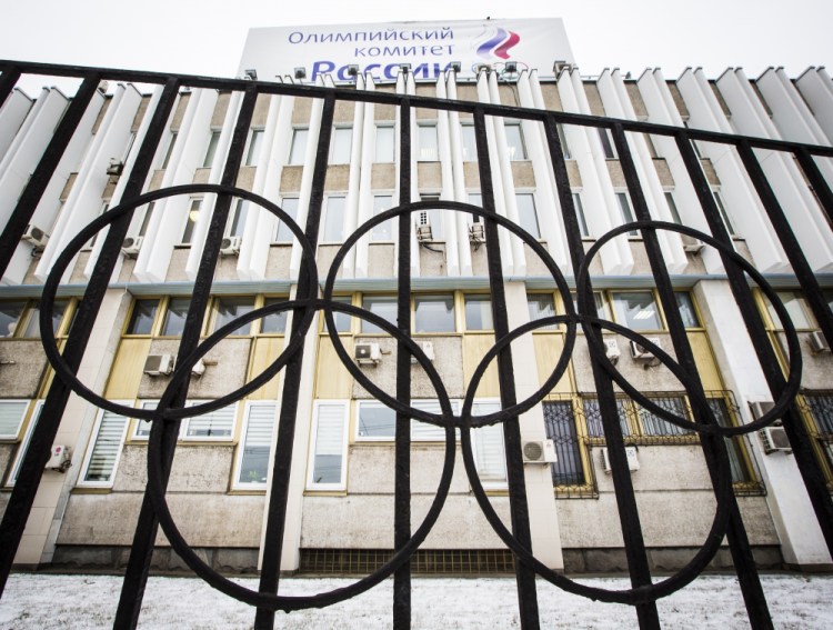 The building of the Russian Olympic Committee is seen through a gate decorated with the Olympic rings, in Moscow, Russia in 2017. 