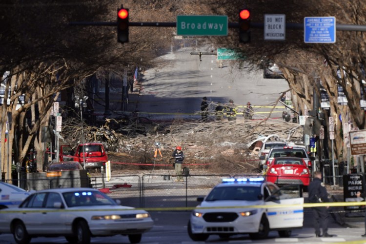 Investigators continue to examine the site of an explosion Sunday, Dec. 27, in downtown Nashville, Tenn. 