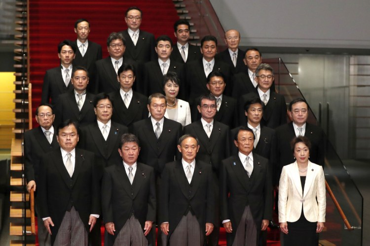 Japan's Prime Minister Yoshihide Suga, front center, and his Cabinet in September at his official residence in Tokyo. 

