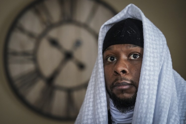 Myon Burrell is photographed at his home in Minneapolis, Thursday, Dec. 17, 2020, two days after his release from prison. Minnesota's pardon board on Tuesday commuted the sentence of Burrell, 34, who was sent to prison for life as a teen in a high-profile murder case that raised questions about the integrity of the criminal justice system. (AP Photo/John Minchillo)
