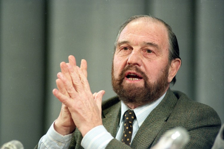 George Blake, a former British spy who doubled as a Soviet agent, gestures during a news conference in Moscow in 1992. Russia’s Foreign Intelligence Service announced his death on Saturday without giving any details. Russian President Vladimir Putin expressed condolences, hailing Blake as a “brilliant professional” and a man of “remarkable courage.” (AP Photo/Boris Yurchenko, File)