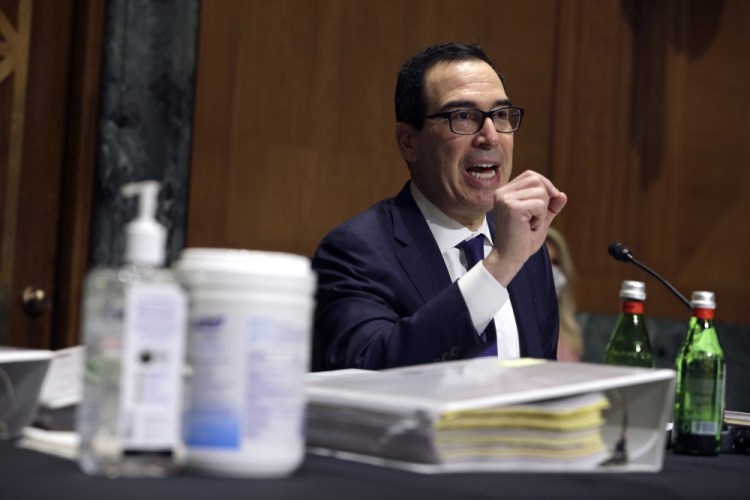 Treasury Secretary Steven Mnuchin testifies before a Congressional Oversight Commission hearing on Capitol Hill in Washington on Dec. 10. President Trump last week labeled as "disgraceful" the COVID-19 stimulus bill that Mnuchin negotiated on his behalf.