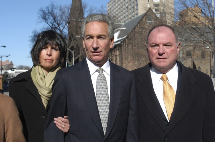 Charles B. Kushner, flanked by his wife, Seryl Beth, and his attorney Alfred DeCotiis arrives at the Newark Federal Court for sentencing in Newark, N.J., in 2005. President Trump on Wednesday pardoned Kushner, the father of his son-in-law. Charles Kushner had pleaded guilty to tax evasion and making illegal campaign contributions. 