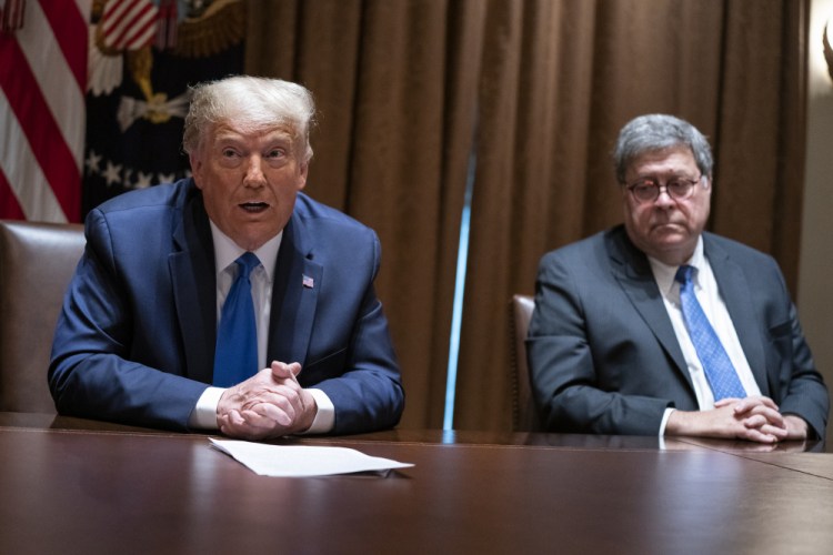 Attorney General William Barr listens as President Trump speaks during a meeting with Republican state attorneys general in September.