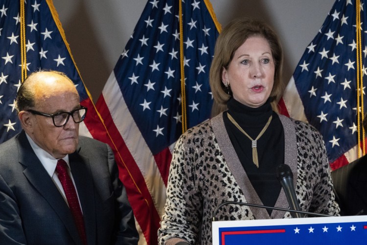 Sidney Powell, right, speaks next to former Mayor of New York Rudy Giuliani, as members of President Donald Trump's legal team, during a news conference at the Republican National Committee headquarters, Thursday Nov. 19, in Washington. 