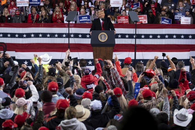 President Trump addresses the crowd Saturday at a rally in Valdosta, Ga., for U.S. Sens. Kelly Loeffler, R-Ga., and David Perdue, R-Ga., who are both facing runoff elections.

