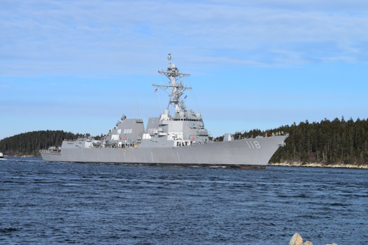 The USS Daniel Inouye coasted down the Kennebec River this month on its way to at-sea trials. The defense policy bill vetoed by President Trump on Wednesday approves two new Arleigh Burke-class destroyers, one of which will be built at Bath Iron Works.