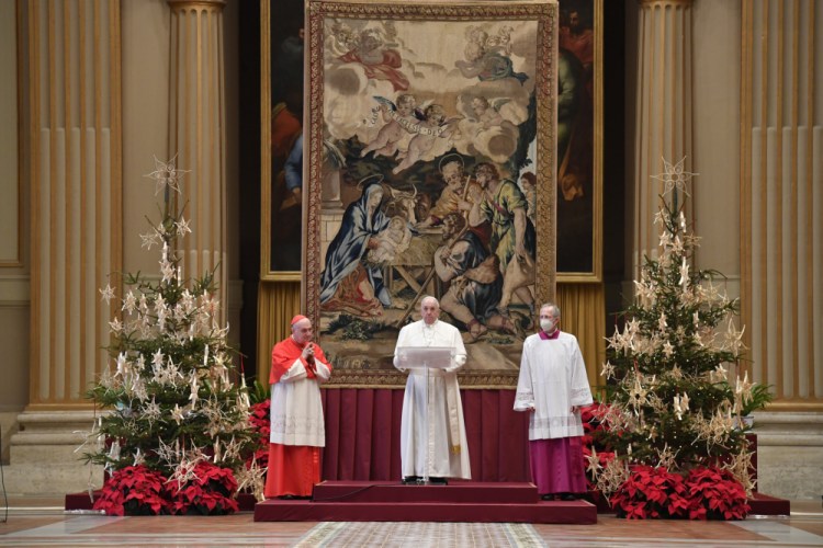 Pope Francis delivers the "Urbi et Orbi" Christmas blessing inside the hall of St. Peter's Basilica, at the Vatican, on Friday. 