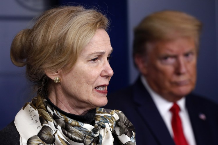 President Donald Trump listens as Dr. Deborah Birx, White House coronavirus response coordinator, speaks about the coronavirus in April 2020. During an interview Monday, Birx  tried to explain her near-silence of the incident, arguing her long experience of military service and training had kicked in.