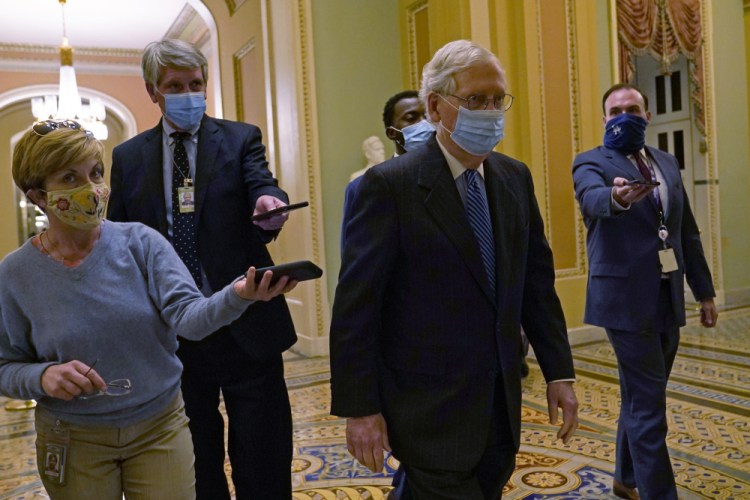 Senate Majority Leader Mitch McConnell of Kentucky, walks past reporters on Capitol Hill in Washington on Tuesday. “We made major headway toward hammering out a bipartisan relief package,” McConnell said Wednesday.