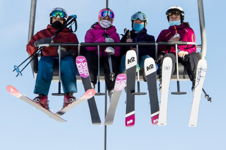 Skiers ride a chairlift on Oct. 30, the opening day of the Verbier ski area in the Swiss Alps.

