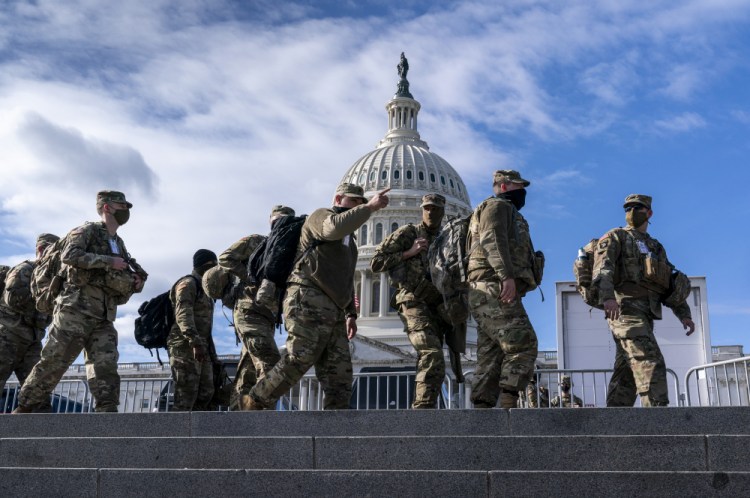 National Guard troops reinforce security around the U.S. Capitol ahead of the inauguration of President-elect Joe Biden and Vice President-elect Kamala Harris, Sunday, Jan. 17, in Washington. 