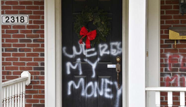 Graffiti is seen on a door of the home of Senate Majority Leader Mitch McConnell, R-Ky., in Louisville, on Saturday.  


