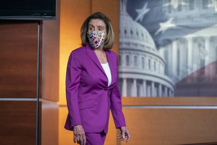 Speaker of the House Nancy Pelosi, D-Calif., holds a news conference on Thursday, the day after violent protesters loyal to President Trump stormed the U.S. Congress, at the Capitol in Washington.