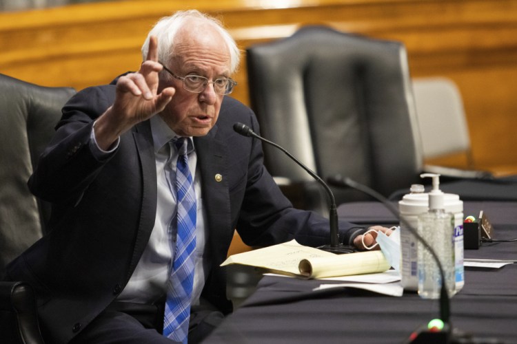 Sen. Bernie Sanders, D-Vt., say the $15 minimum wage proposal should stay in the COVID-19 relief package, even if it means using 'reconciliation' to pass it. (Graeme Jennings/Pool via AP)