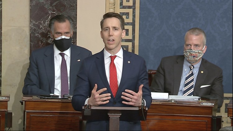 Sen. Josh Hawley, R-Mo., speaks as the Senate reconvenes to debate the objection to confirm the Electoral College Vote from Arizona, after protesters stormed into the U.S. Capitol on Wednesday.
