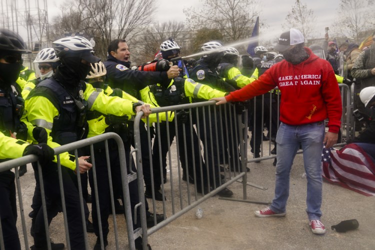 Demonstrators loyal to President Trump are sprayed by police on Wednesday, during a day of rioting at the Capitol. U.S. Capitol Police twice turned down offers of help from federal law enforcement.