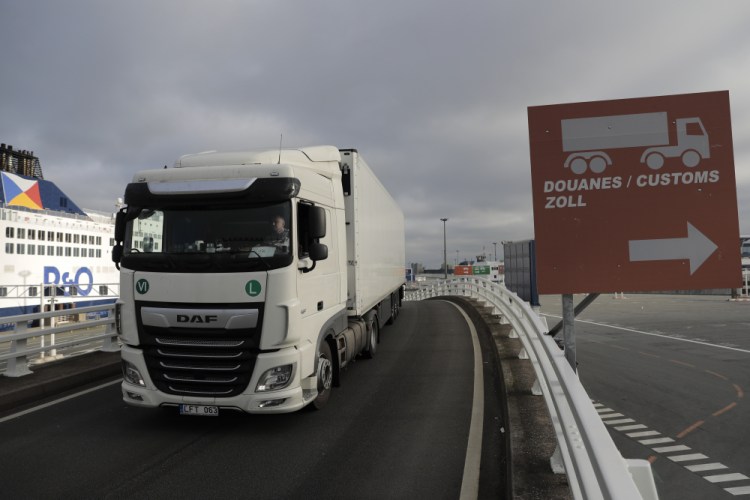 A lorry arrives to board the first ferry heading to Britain after Brexit, Friday in Calais, northern France. Britain left the European bloc's vast single market for people, goods and services at 11 p.m. London time, midnight in Brussels, completing the biggest single economic change the country has experienced since World War II.