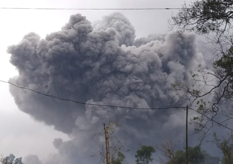 Mount Semeru spews volcanic material during an eruption in Lumajang, East Java, Indonesia, on Saturday.


