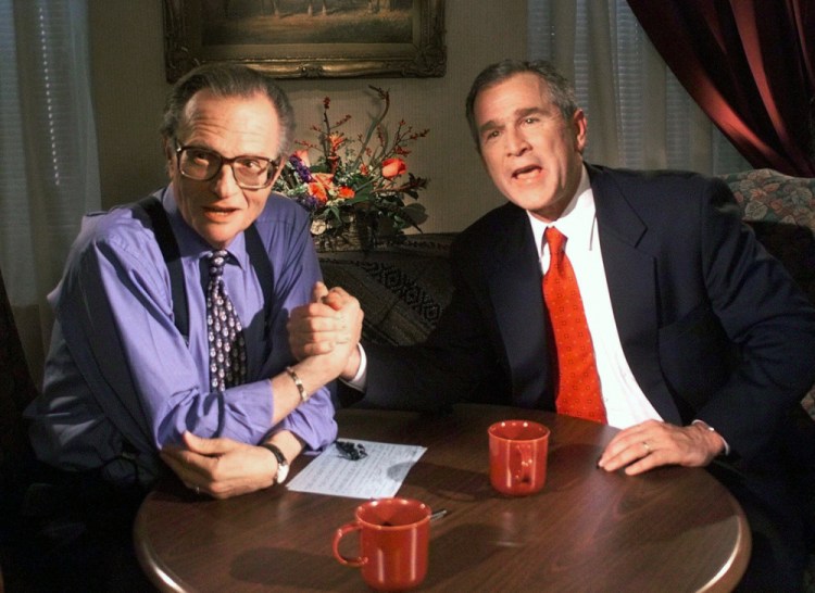 Republican presidential candidate Texas Gov. George W. Bush jokes with CNN's Larry King after finishing the "Larry King Live" show from the Wildhorse Saloon in Nashville, Tenn., in 1999
