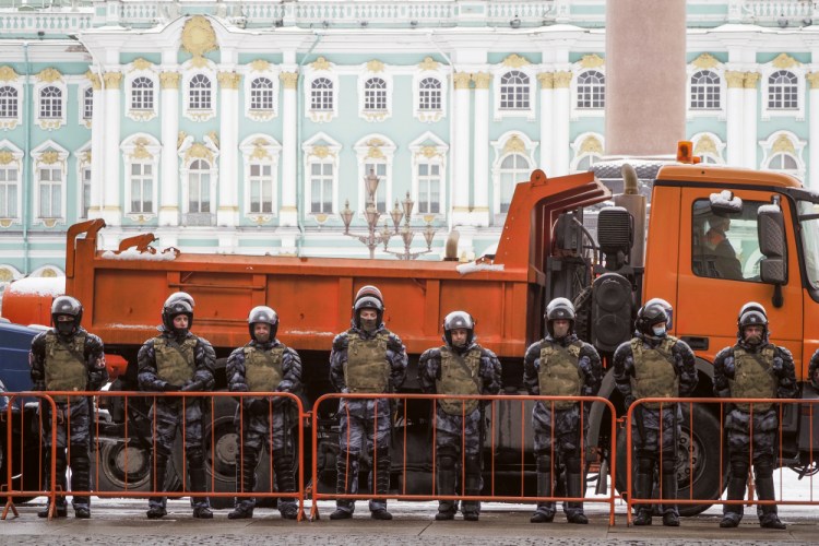 Russian Rosguardia (National Guard) soldiers stand blocking the entrance to the Palace Square on Saturday, a day before a protest in St. Petersburg, Russia. (AP Photo/Dmitri Lovetsky)