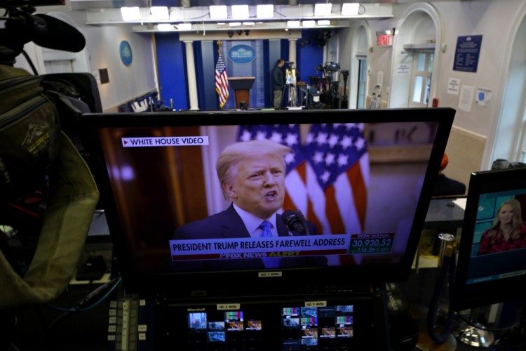 President Trump is seen on a network monitor after his pre-recorded farewell speech was released, inside the Brady Press Briefing Room at the White House on Tuesday in Washington. 