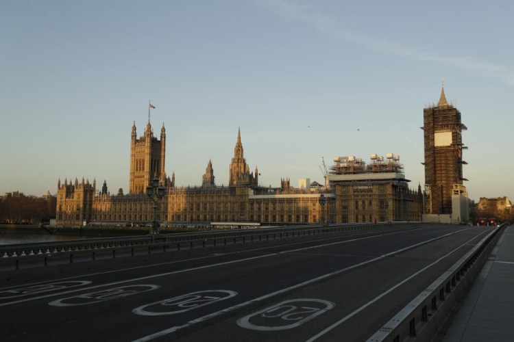 An almost empty Westminster Bridge stands backdropped by the early morning sun on the scaffolded Houses of Parliament and the Elizabeth Tower in London on March 24, 2020 – the first day of Britain's first lockdown. Critics say the government’s slow response as the virus emerged from China was the first in a string of lethal mistakes.