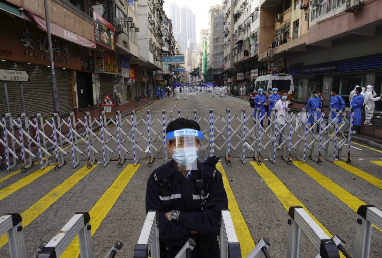 A police officer stands guard in the Yau Ma Tei area of Hong Kong on Saturday.
