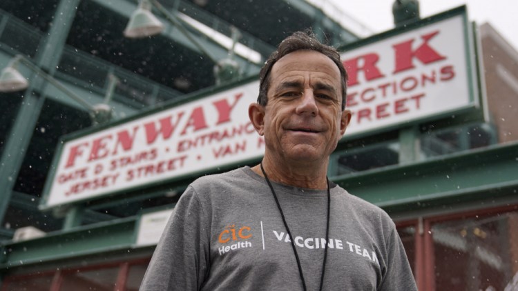 Boston Marathon Race Director Dave McGillivray, shown on Thursday outside Fenway Park in Boston,  has been asked by the state of Massachusetts to run mass vaccination operations at Gillette Stadium and Fenway Park. Event organizers and other unconventional logistics experts are using their skills to help the nation vaccinate as many people against COVID-19 as possible. 