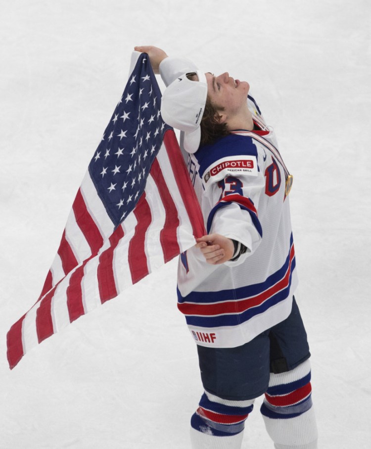 United States' Cole Caufield celebrates the team's win over Canada in the title game in the IIHF World Junior Hockey Championship, Tuesday night in Edmonton, Alberta. 