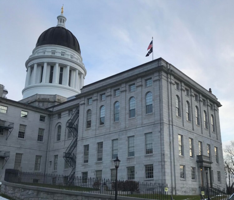 The scene outside Maine's State House was quiet Sunday morning. Aside from two Capitol police cruisers, the parking lot was mostly empty and no one was outside. 
