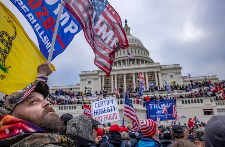 Supporters of President Donald Trump storm the U.S. Capitol building on Wednesday. Many in Washington are concerned that riots will return around the inauguration Jan. 20. MUST CREDIT: Washington Post photo by Evelyn Hockstein