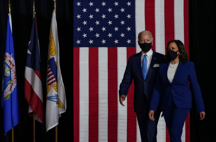 Joe Biden and Kamala Harris don masks during an August event in Wilmington, Del. 